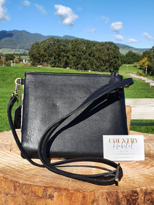 The Torronto - Light Black and White Cowhide Clutch Bag